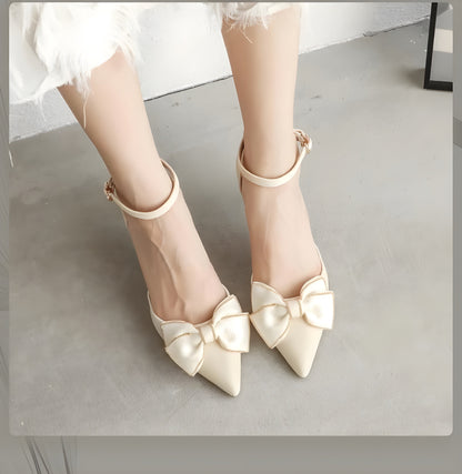 Elegant pearl women's high heels with pointed toes, gold-trimmed bow detail, and ankle strap design."